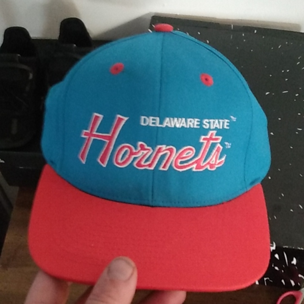 Vintage East Coast college sports snapbacks.